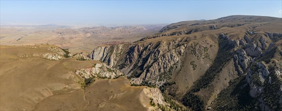 Moldo-Ashuu Pass, mountain landscape with steep rocks between yellow hills, near Baetov, Naryn