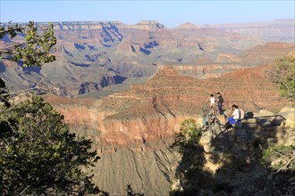 Tourists at a viewpoint of the Grand Canyon with a view of the deep gorges, Grand Canyon National