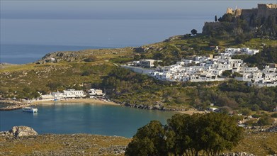 View of a white town on the coast with a castle on a hill, Lindos, Rhodes, Dodecanese, Greek