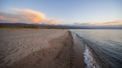 Shore with sandy beach, Issyk Kul Lake at sunset, Issyk Kul, Kyrgyzstan, Asia
