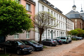 Row of houses on Orangeriestrasse, St Maximilian's Church at the back, Old Town, Duesseldorf, North
