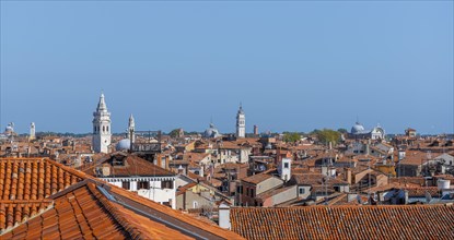 View over the roofs of Venice with many church towers, view from the roof of the Fondaco dei