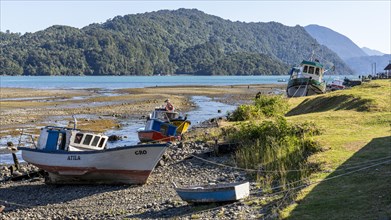 Boats at low tide, Hornopiren Waterfront, Hornopiren, Carretera Austral, Chile, South America