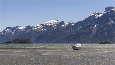 Tour boat on the beach, Estancia Caleta Maria, Routa Y-85, Timaukel, Tierra del Fuego, Magallanes