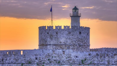 An illuminated fortress during the blue hour with a clear sky, sunrise, dawn, Fort of Saint