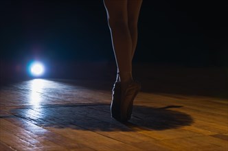 Closeup of ballet dancer legs on fingertips. Beautiful classical ballet composition. Poite