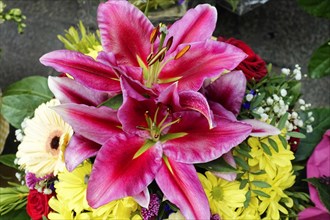 Lively bouquet with a large pink Lily (Lilium candidum) in focus, flower sale, Central Station,
