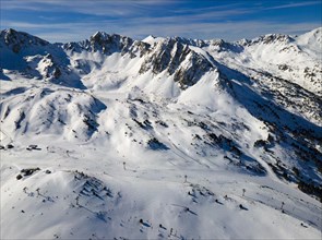 Panoramic view of snow-covered mountains with ski lifts, Grau Roig, Encamp, Andorra, Pyrenees,