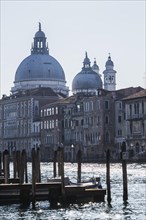 Silhouetted view of Grand canal and Santa Maria della Salute basilica with Renaissance