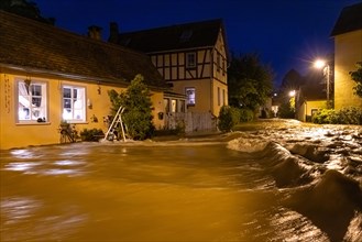 After heavy rainfall, the centre of the Frankfurt district of Niederursel is under water,