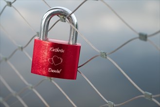A love lock on the railing of the bicycle and pedestrian bridge over the Danube in Deggendorf,