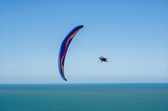 Camboriu, Brazil, December 10, 2017: Students practicing paragliding on the hill, South America