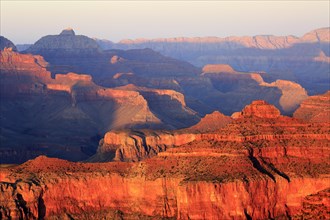 A new day begins with the sunrise that bathes the Grand Canyon in Orange, Grand Canyon National