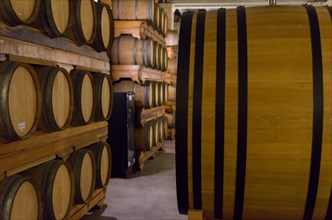 Oak barrels for wine aging in an underground cellar in Vale dos Vinhedos