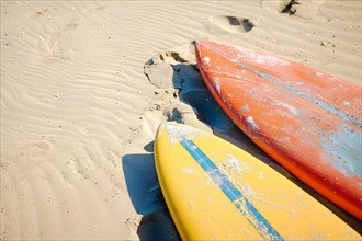 Two surfboards lying on beach. KI generiert, generiert, AI generated