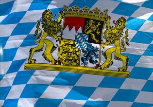 Bavarian flag with coat of arms moves in the Convolvulus