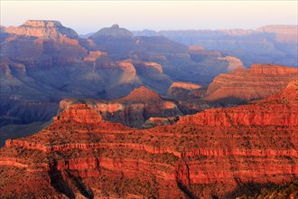 The Grand Canyon presents itself in red and purple colours at dusk, Grand Canyon National Park,