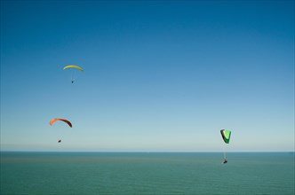 Camboriu, Brazil, December 10, 2017: Students practicing paragliding on the hill, South America