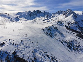 Aerial view of a snow-covered ski resort with mountains in the background, Grau Roig, Encamp,