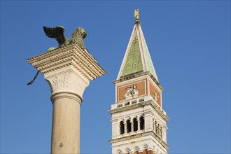 Bronze winged lion column and Campanile bell tower, St Mark's Square, San Marco, Venice, Veneto,
