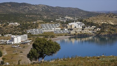 View of a picturesque coastal landscape with beach and hotel complexes, Lindos, Rhodes, Dodecanese,
