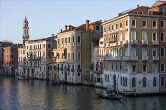 Evening atmosphere on the Grand Canal with gondoliers, view from the Rialto Bridge, Venice, Veneto,