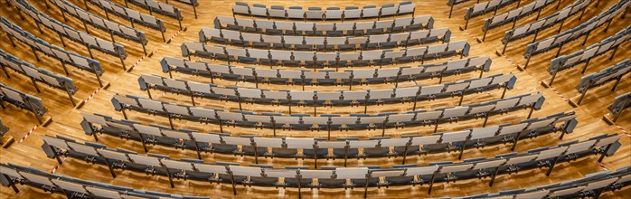 View from above into an empty lecture theatre with rows of seats, interior view, Department of