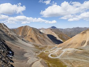 Road with serpentines, mountain pass in the Tien Shan, Chong Ashuu Pass, Kyrgyzstan, Issyk Kul,