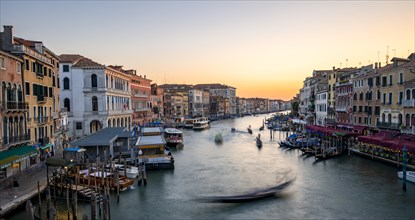 Long exposure, view over the Grand Canal with gondolier in the evening light, from the Rialto