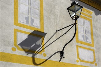 Lantern with shadow at the town theatre, Kaufbeuern, Allgaeu, Swabia, Bavaria, Germany, Europe