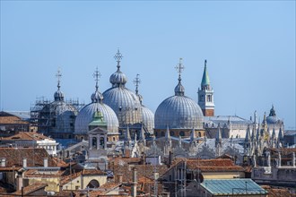View over the rooftops of Venice to the domes of St Mark's Basilica, view from the roof of the