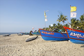 Colourful fishing boats on Marari Beach, Mararikulam, Alappuzha district, Kerala, India, Asia