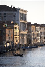 View over the Grand Canal with gondoliers in the evening light, from the Rialto Bridge, Venice,