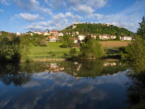 Reflection in a pond, Riegersburg in the morning light, Riegersburg, Styrian volcanic region,