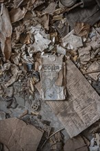 Old newspaper and objects from the USSR, Abandoned ruins, ghost town Enilchek in the Tien Shan