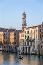 Evening atmosphere on the Grand Canal with gondoliers, view from the Rialto Bridge, Venice, Veneto,