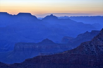 The twilight cloaks the Grand Canyon in a deep blue and emphasises the contours, Grand Canyon