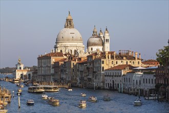 Water taxis and vaporettos on Grand Canal with Renaissance architectural style palace buildings and