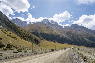 Car on road, mountain valley in the Tien Shan Mountains, Jety Oguz, Kyrgyzstan, Asia