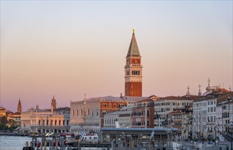 Campanile bell tower and Doge's Palace at sunrise, waterfront promenade, Venice, Veneto, Italy,