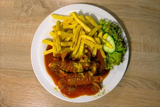 Currywurst with French fries served in a pub, Franconia, Bavaria, Germany, Europe
