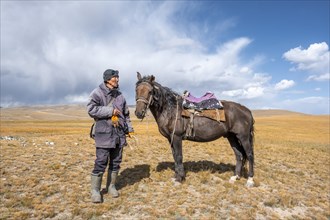 Nomadic life on a plateau, shepherd on horse, Tian Shan Mountains, Jety Oguz, Kyrgyzstan, Asia