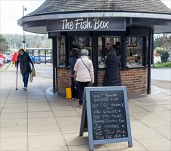 Customers buying fresh fish from The Fish Box fishmongers, Woodbridge, Suffolk, England, UK