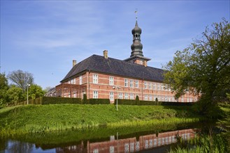Castle in front of Husum with reflection in the castle moat in Husum, North Friesland district,