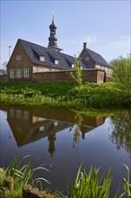 Moat with reflection of the castle in front of Husum, North Frisia district, Schleswig-Holstein,