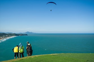 Camboriu, Brazil, December 10, 2017: Students practicing paragliding on the hill, South America