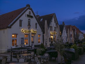 Restaurants at Greetsiel harbour by night, Greetsiel, Krummhoern, East Frisia, Lower Saxony,