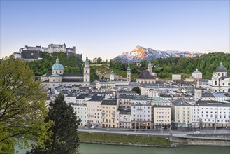 View of the fortress Hohen Salzburg with old town and Untersberg, blue sky, Salzburg, Austria,