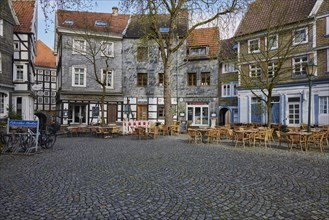 Houses and outdoor areas of restaurants on the church square in Hattingen, Ennepe-Ruhr district,