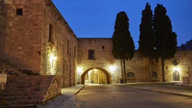 Old stone house in a quiet place, illuminated by street lamps at dusk, night shot, Rhodes Old Town,